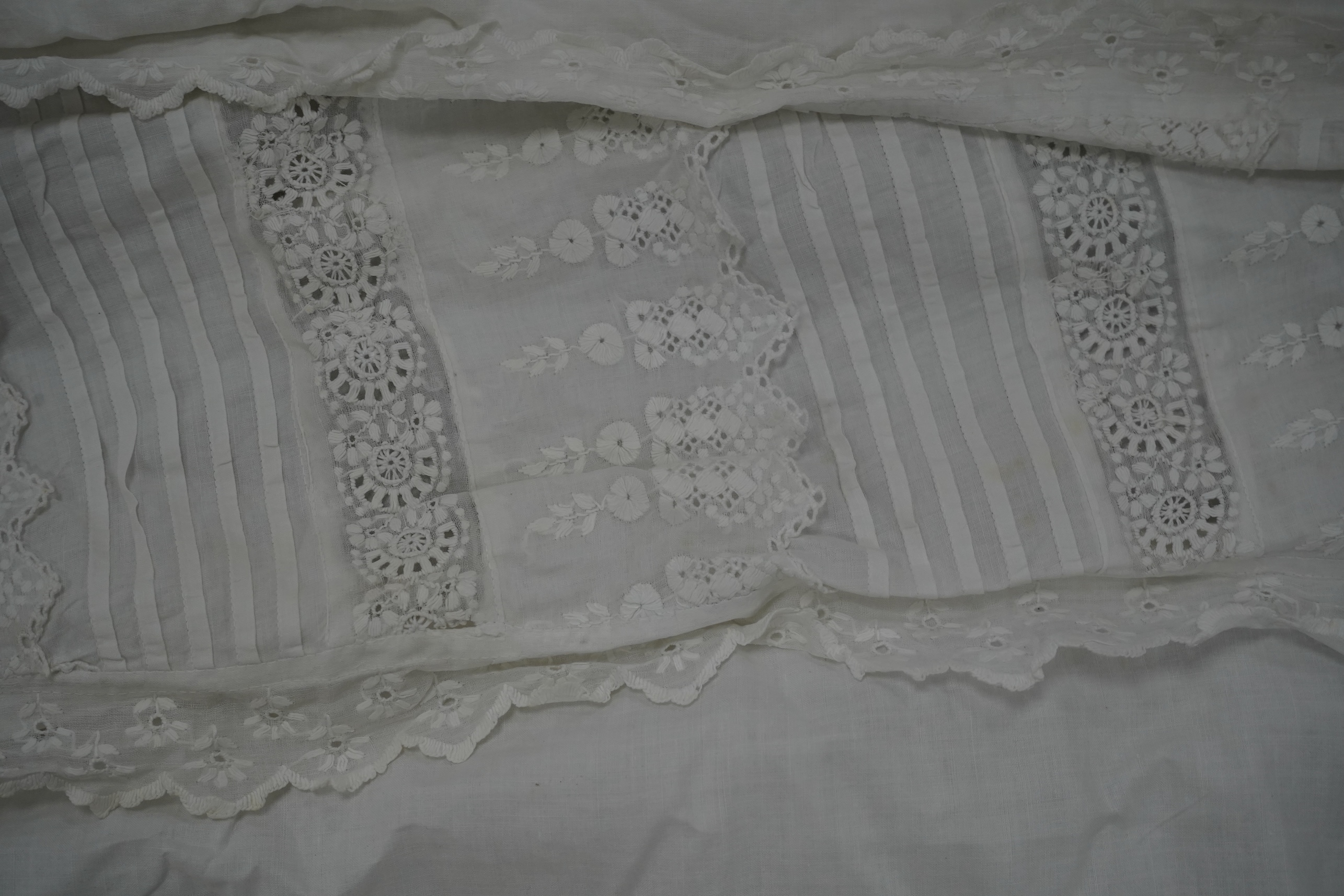 Five Victorian white worked fine cotton and lawn baby’s christening gowns. mostly worked with embroidery anglaise, feather stitching, tucking, drawn thread work and lace edging, longest 41cm. Condition - in good conditio